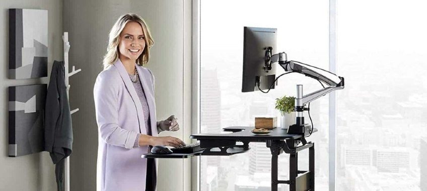 lady-using-sit-stand-desk-chatfield-family-sports